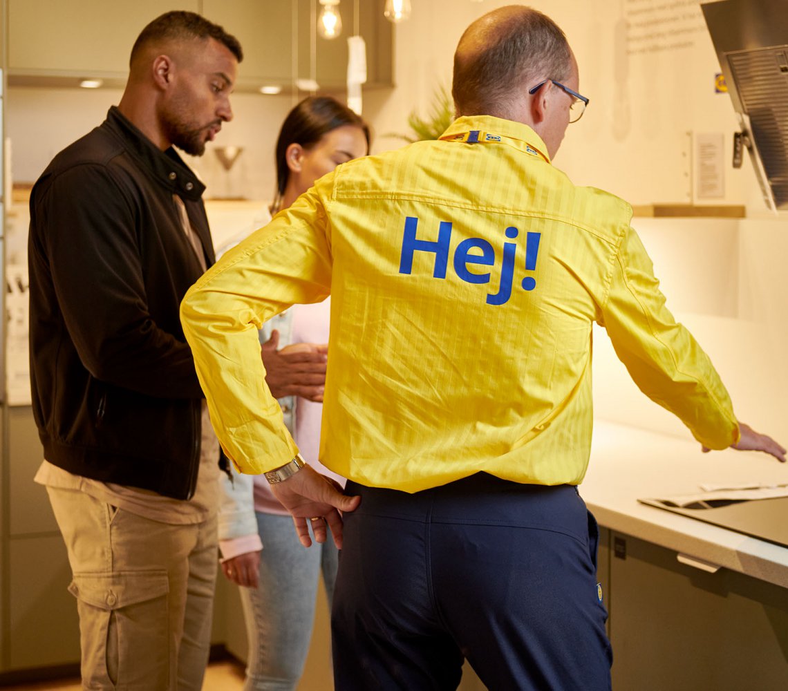 co-worker with customers in IKEA store