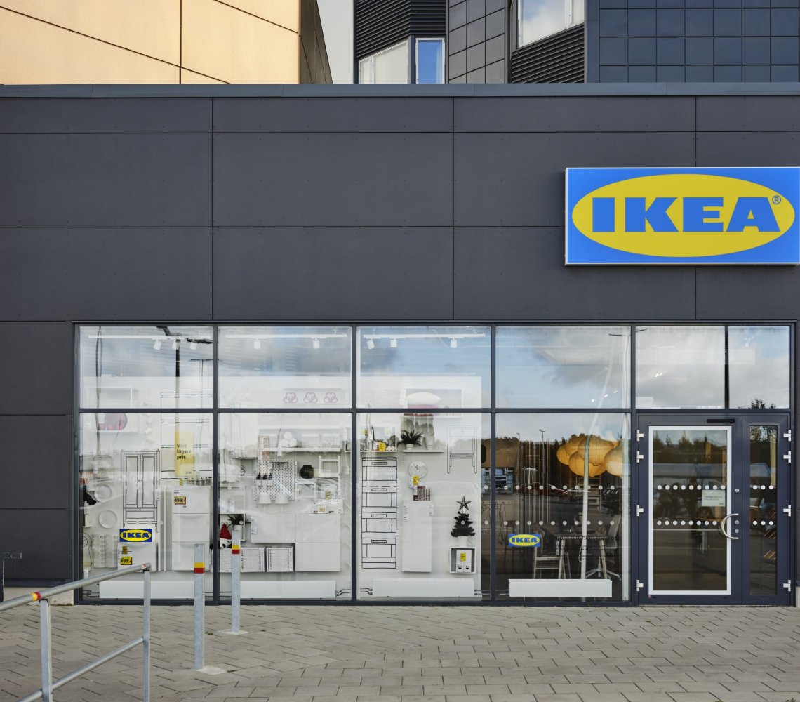 Picture of the IKEA city store and the IKEA logo.