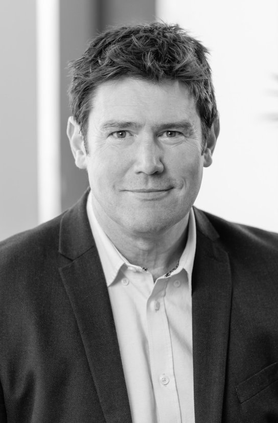 Black and white portrait of Colm Mugan
