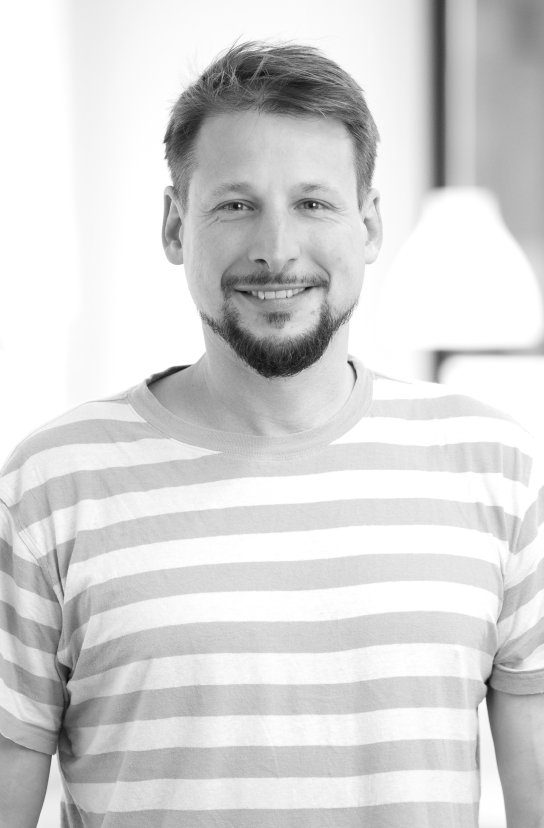 Black and white portrait of Kevin Berenfeld